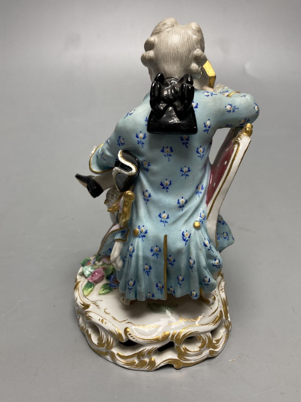 A pair of Meissen figures in 18th century dress, height 13cm